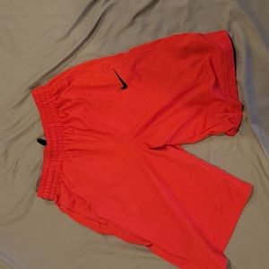 Red Nike shorts